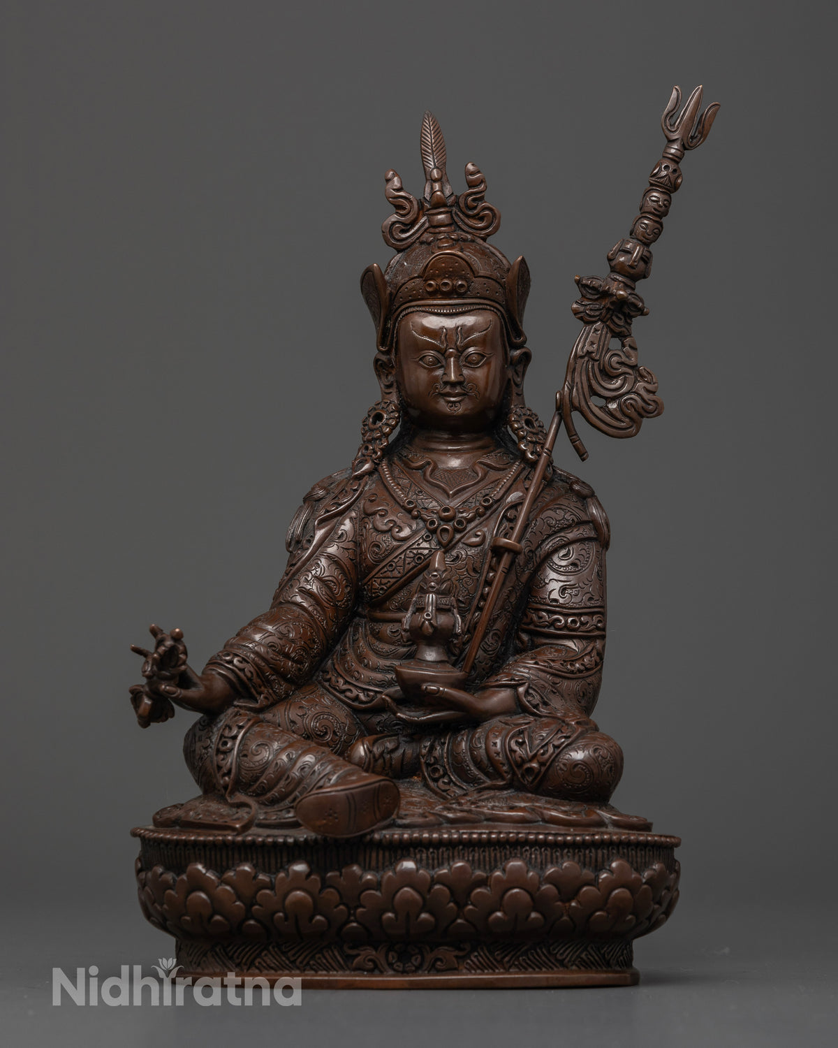Oxidized copper Guru Rinpoche Buddhist statue crafted by a Newari artisan in Patan, Nepal