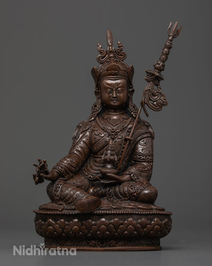 Oxidized copper Guru Rinpoche Buddhist statue crafted by a Newari artisan in Patan, Nepal