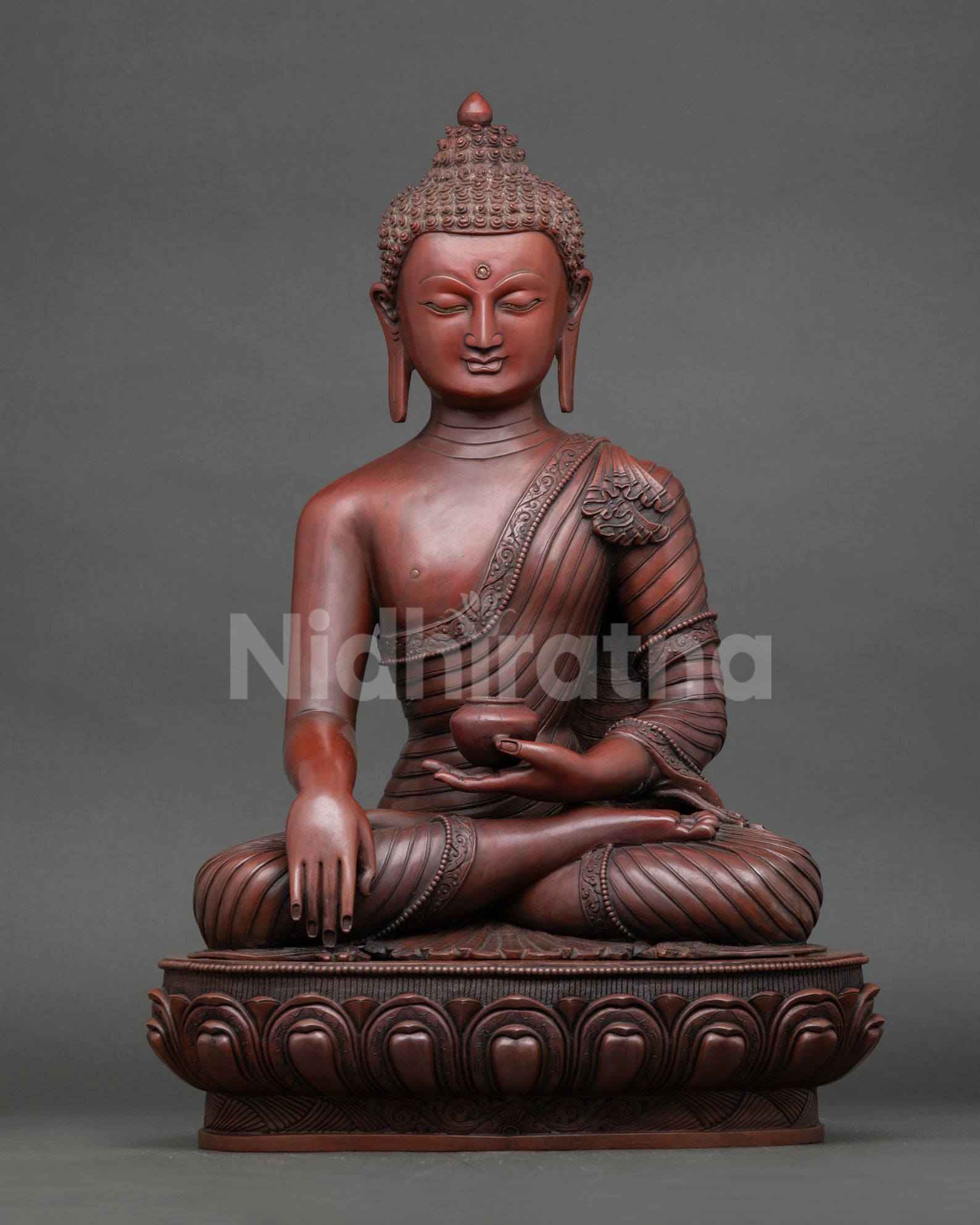 Oxidized copper Shakyamuni Buddha statue in bhumisparsha mudra on lotus pedestal