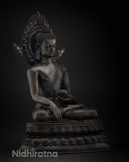 Right side view of oxidized copper Shakyamuni Buddha statue
