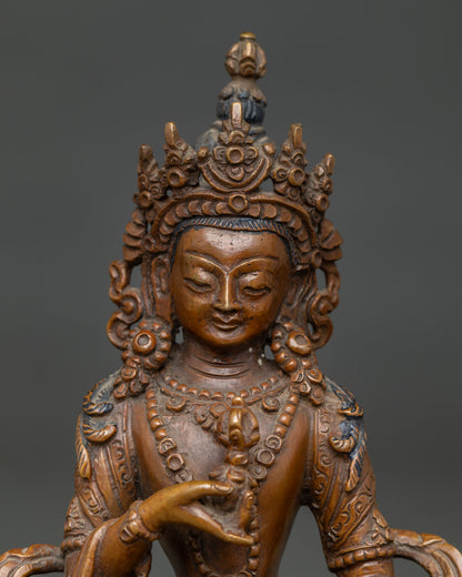 Oxidized Vajrasattva statue with jeweled crown and ornate ornaments.