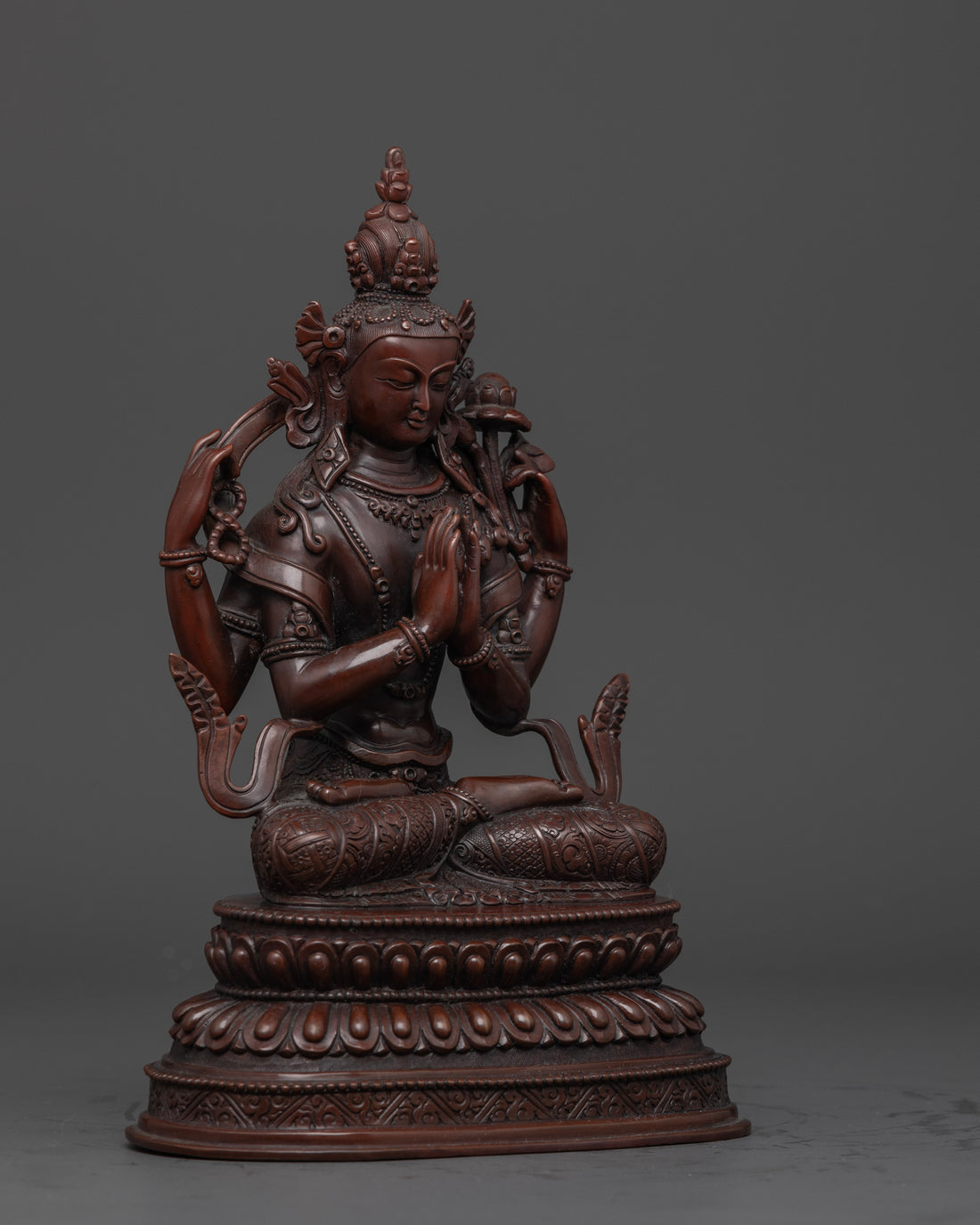 another side view of masterfully crafted oxidized chenrezig statue