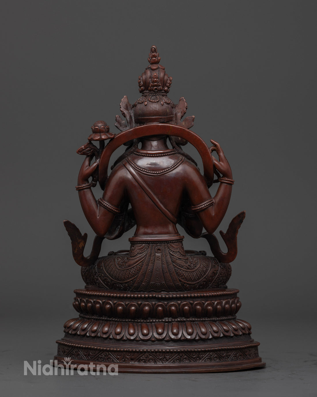 back view of brown copper chenrezig statue