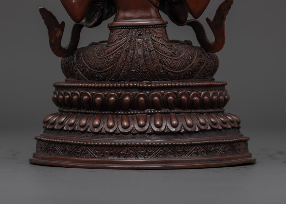 lotus seat holding a moon disc upon which the oxidized chenrezig statue sits