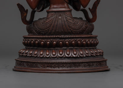 lotus seat holding a moon disc upon which the oxidized chenrezig statue sits