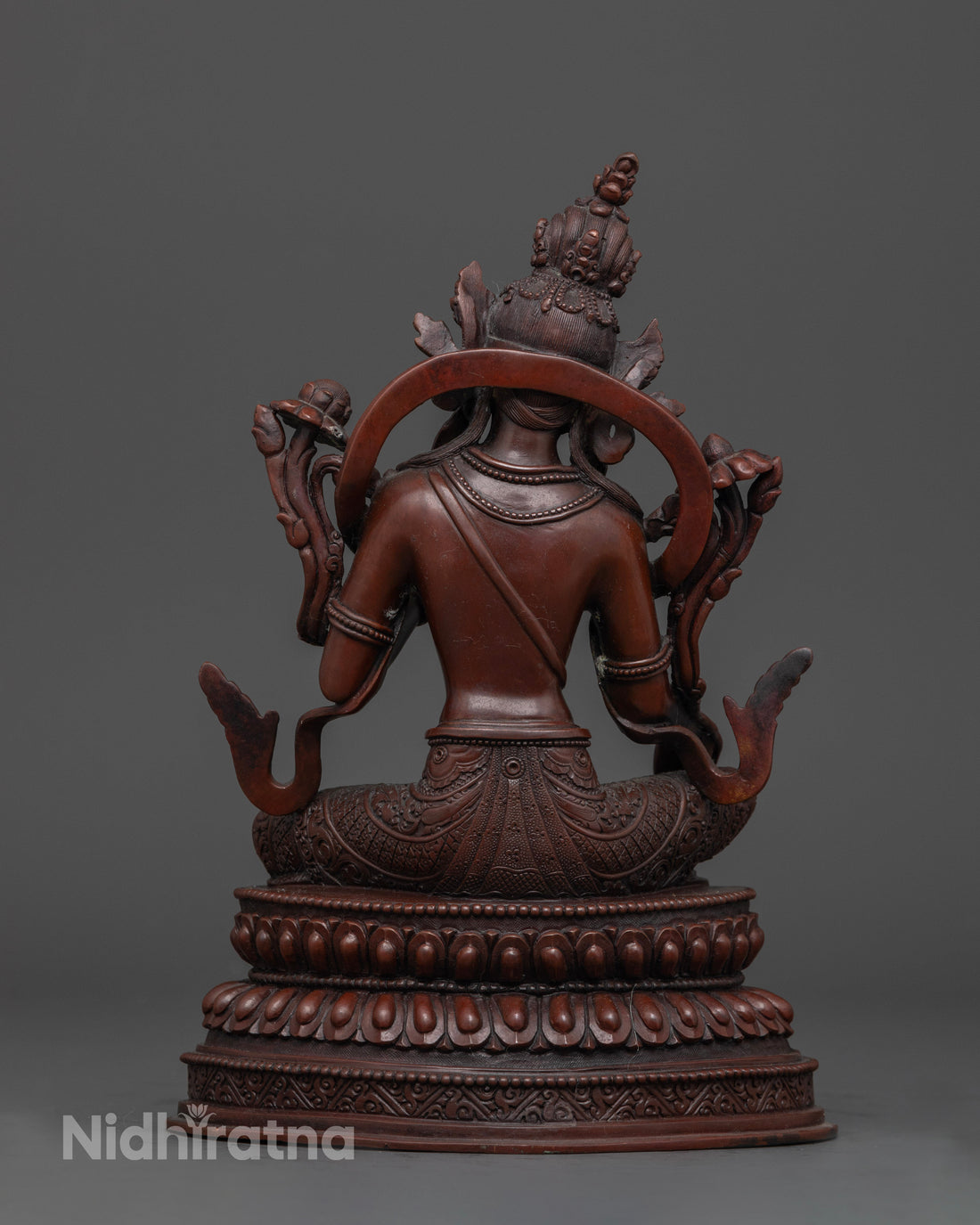 back view of oxidized copper green tara statue