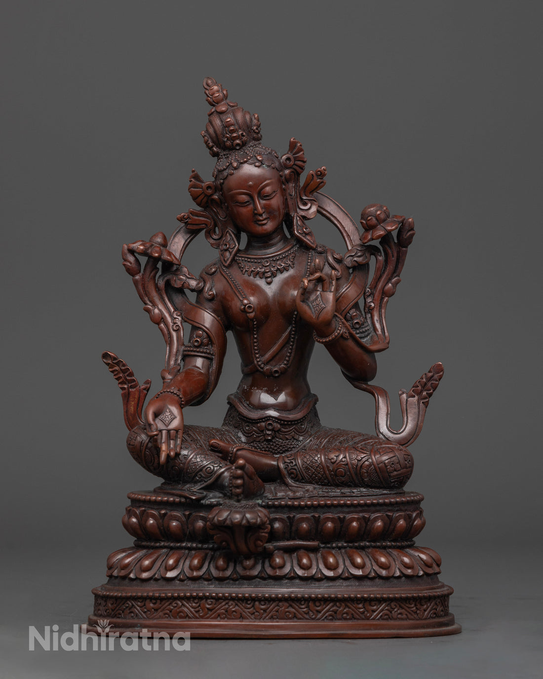 front view of elegantly crafted oxidized green tara statue