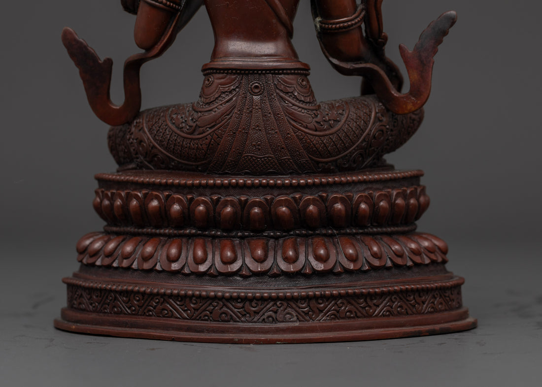 oxidized green tara statue upon a moon disc upon a lotus seat