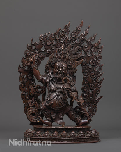 oxidized vajrapani statue front view showing warrior pose and lotus seat in earthy copper finish