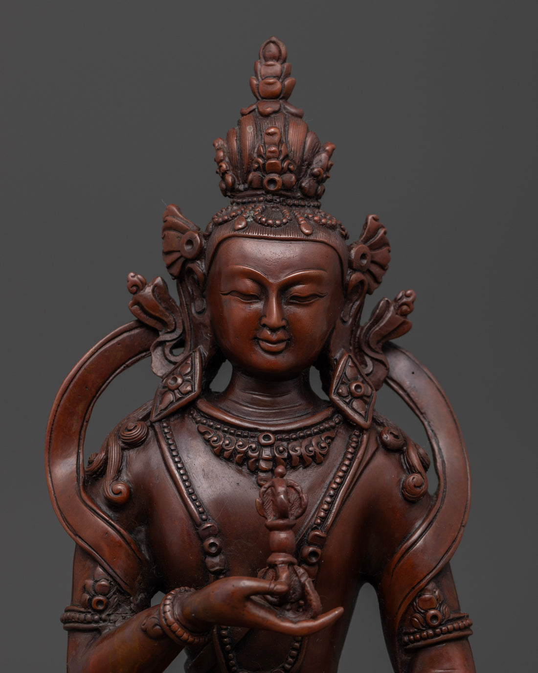 face of oxidized vajrasattva statue made with oxidized copper fit for outdoor home decor