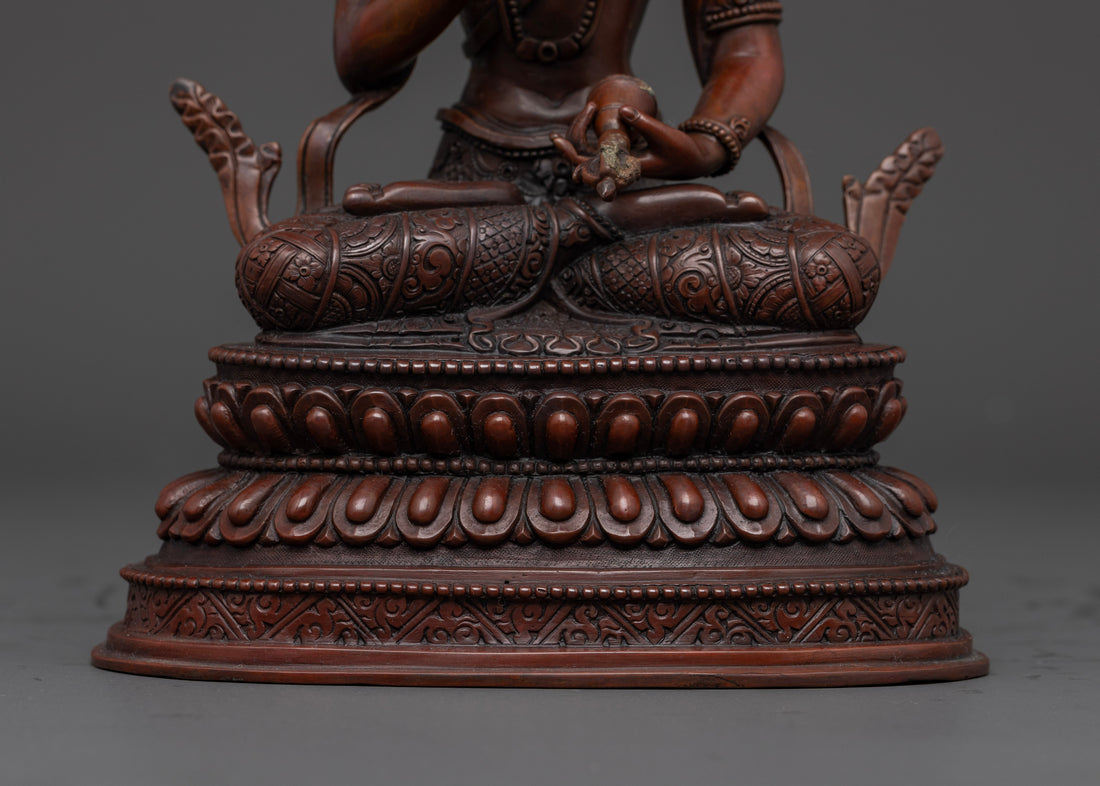 oxidized vajrasattva statue sitting on a moon disc upon a lotus disc