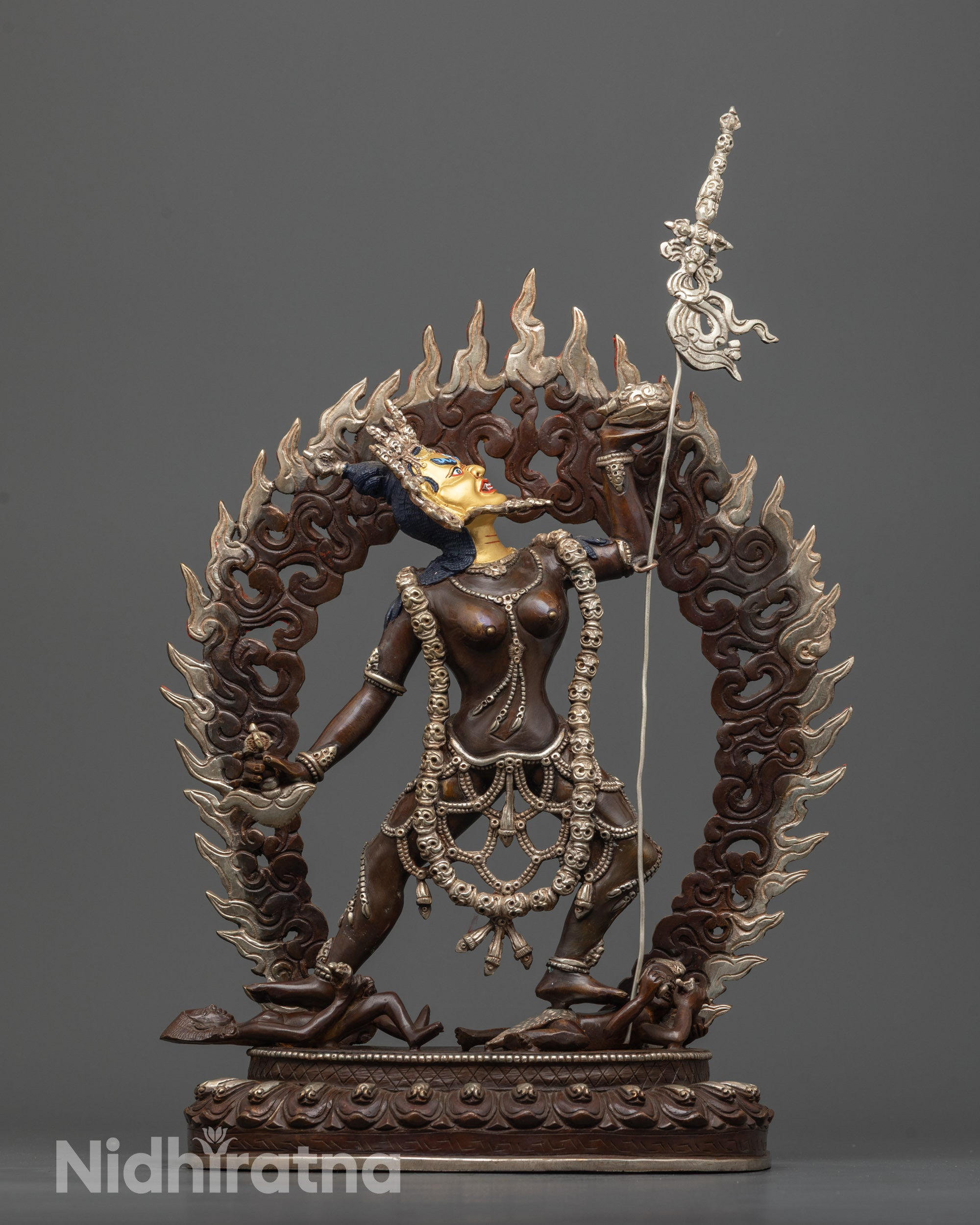 oxidized vajrayogini statue front view with gold-gilded face and flaming halo