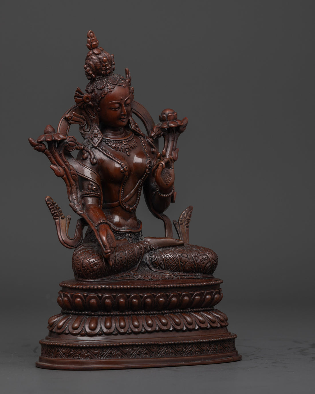 side view of oxidized white tara statue