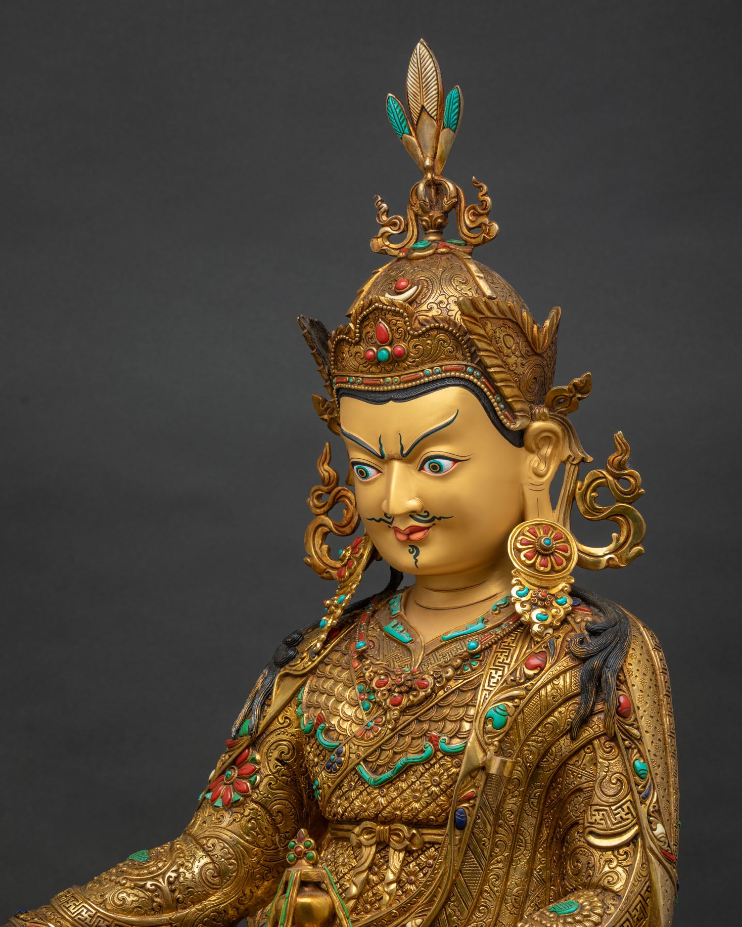 Padmasambhava statue side close up, hand-chased robe scrollwork, lotus crown detail