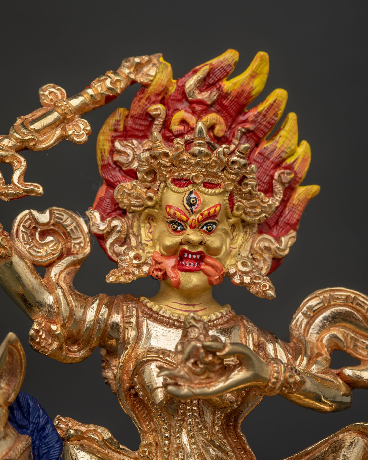 Palden Lhamo seated on mule with wrathful attendants and kapala.