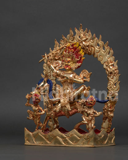 Palden Lhamo statue holding khatvanga staff and skull cup.