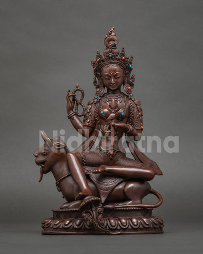 Paripurani Tara statue with trident on a mythical mount, fulfiller of aims, oxidized copper