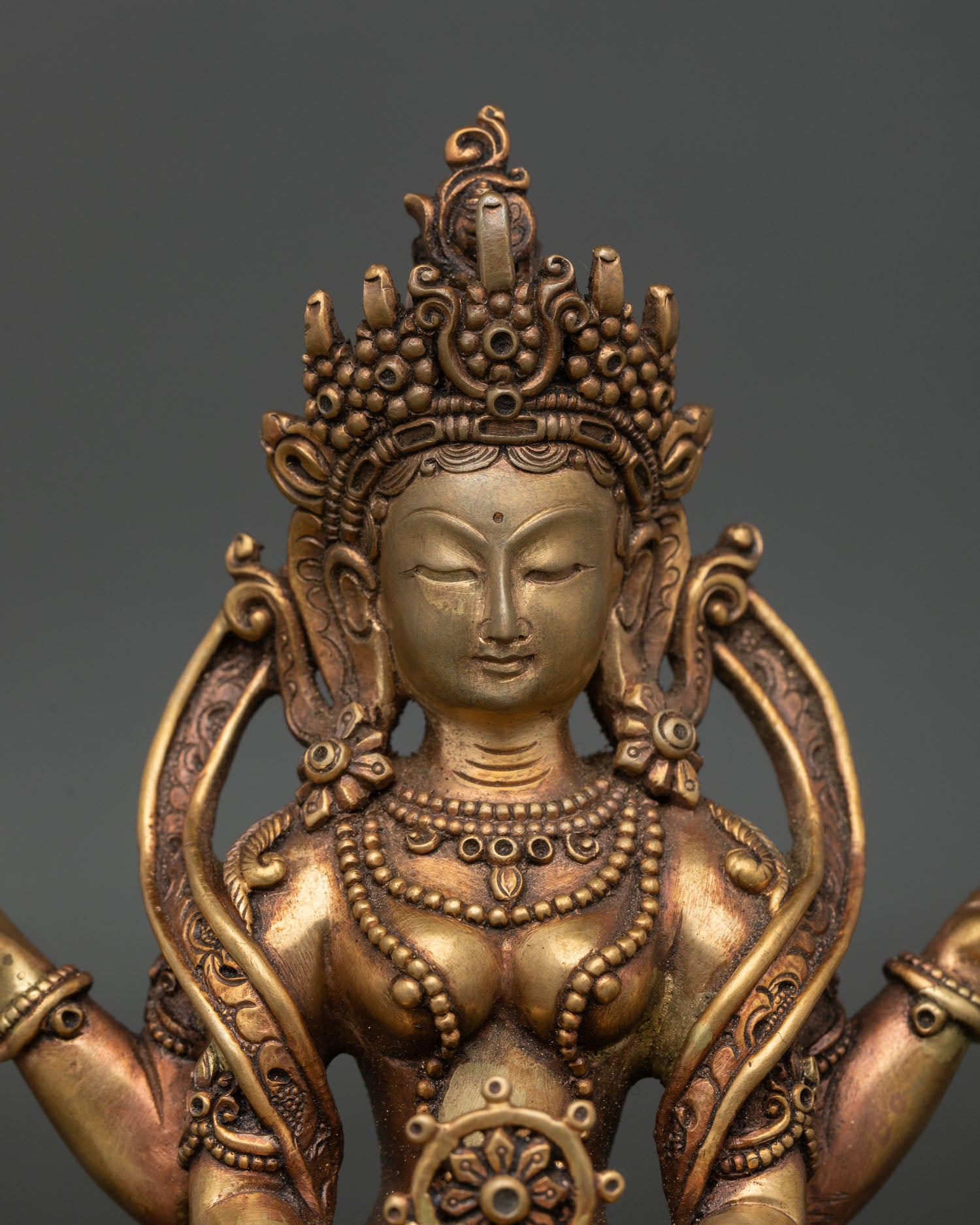 Prajnaparamita statue holding vajra and sacred scripture in upper hands.
