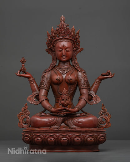 Prajnaparamita statue seated on lotus pedestal with four arms and sacred Buddhist symbols