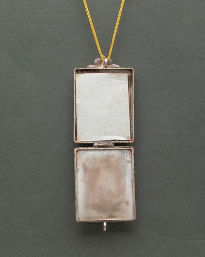 Pure silver White Tara Ghau locket on golden silk cord, handcrafted by Newari artist in Nepal