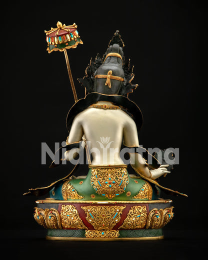 Rear angle of Dukar Buddhist statue showing gold-gilded back details and lotus base
