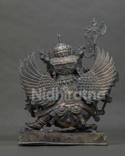 Rear view of bronze Hayagriva statue showing scale-textured wings and detailed back ornaments
