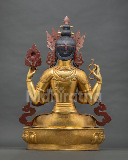 Rear view of gold Chenrezig statue showing red-painted backrest and intricate back detailing