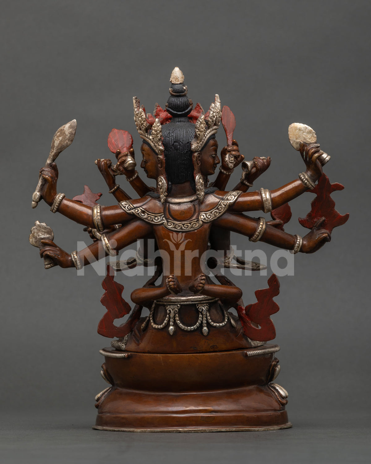 Rear view of Guhyasamaja Yab-Yum statue showing back details, red painted accents and copper base