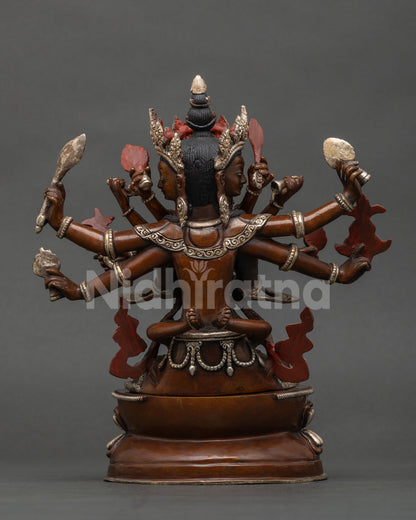 Rear view of Guhyasamaja Yab-Yum statue showing back details, red painted accents and copper base