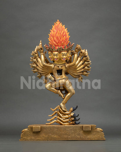 Rear view of Hevajra statue without halo, showing flaming crown, fanned arms and Maras underfoot