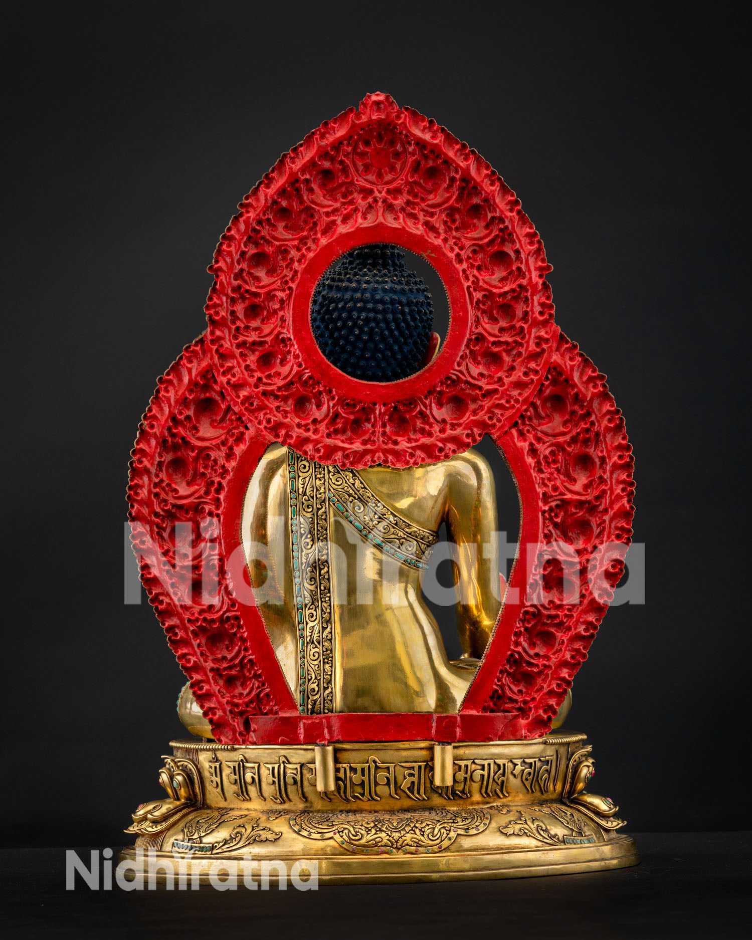 Rear view of Medicine Buddha showing ornate red prabhavali halo and gilded back, Nepal copper statue