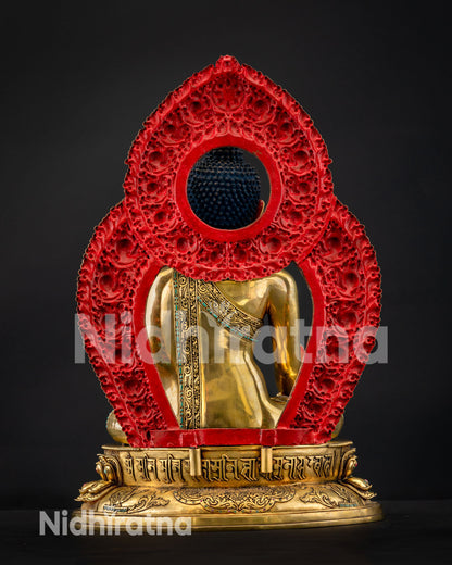 Rear view of Medicine Buddha showing ornate red prabhavali halo and gilded back, Nepal copper statue