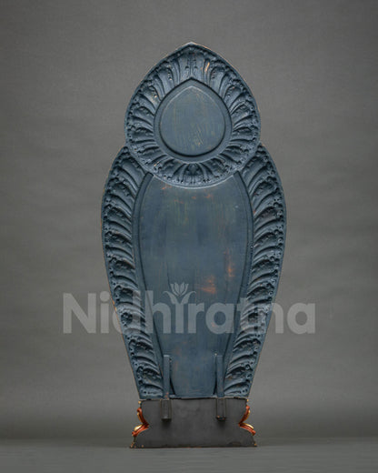 Rear view of Padmapani Lokeshvara statue halo with carved petal design and painted blue finish