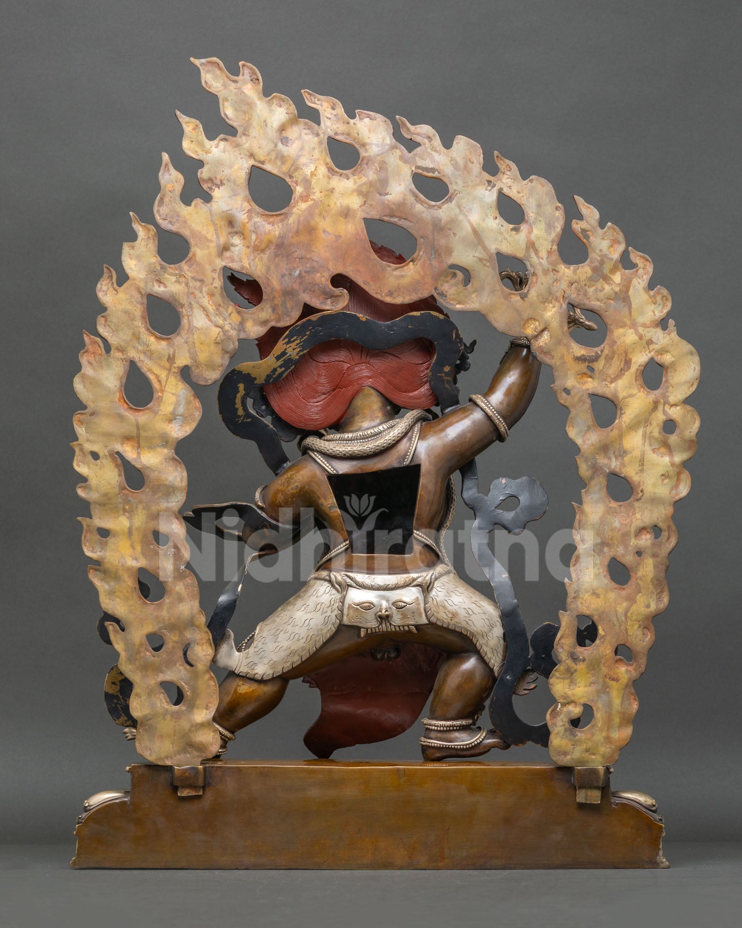 rear view of Vajrapani statue handcrafted Nepalese Buddhist art with detailed robe carving and patina finish