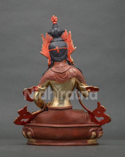 Rear view of Vajrasattva statue showing partially oxidized finish and red flame halo