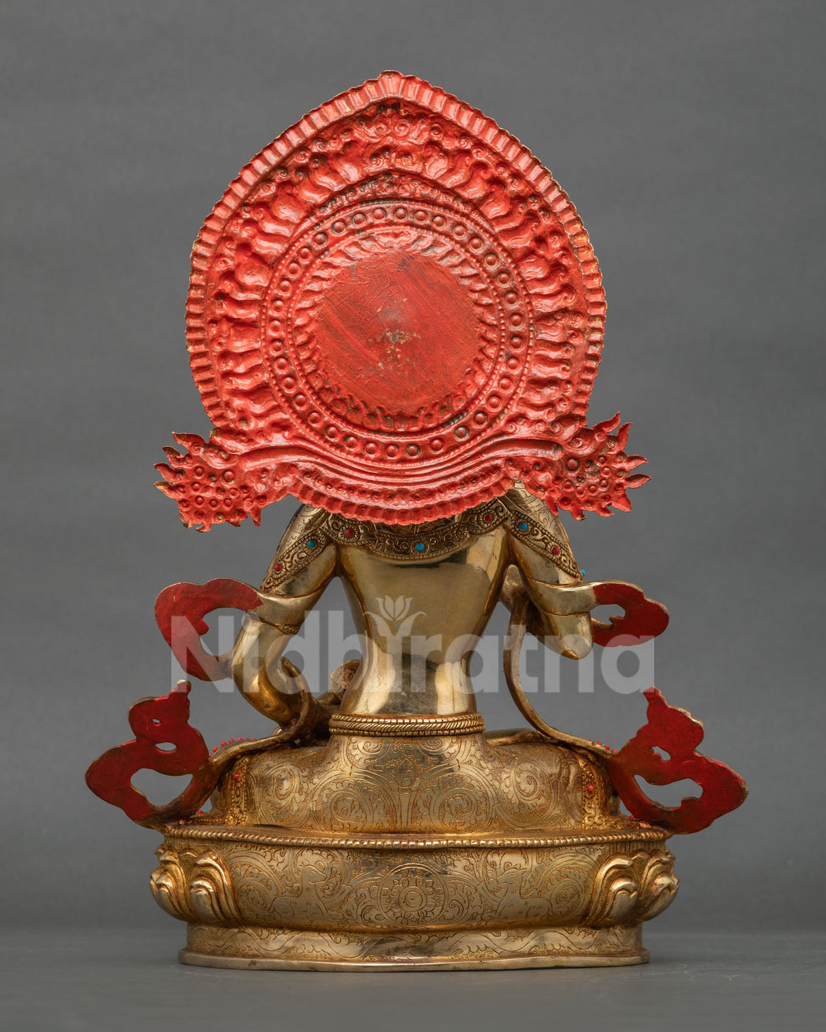 Rear view of Vajrasattva statue showing red halo