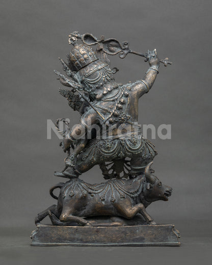 Rear view of Yamantaka Vajrabhairava bronze statue with detailed ornaments and buffalo sculpture