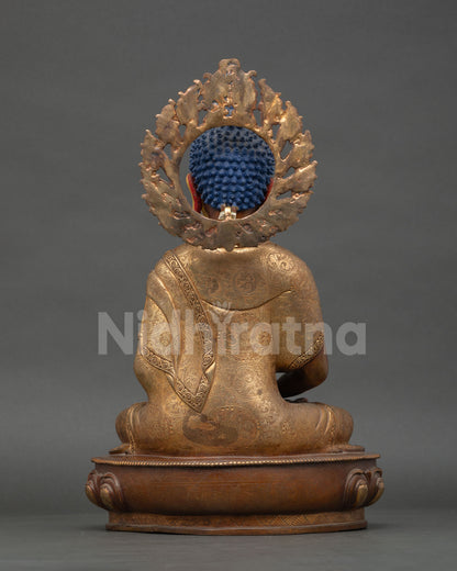 Rear view oxidized copper patina Buddha statue with detailed robe carvings and traditional Nepalese art