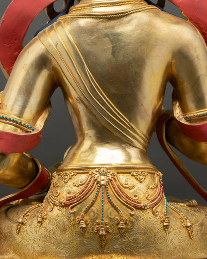 Rear view Vajrasattva statue back details golden robe draped repoussé copper Nepal