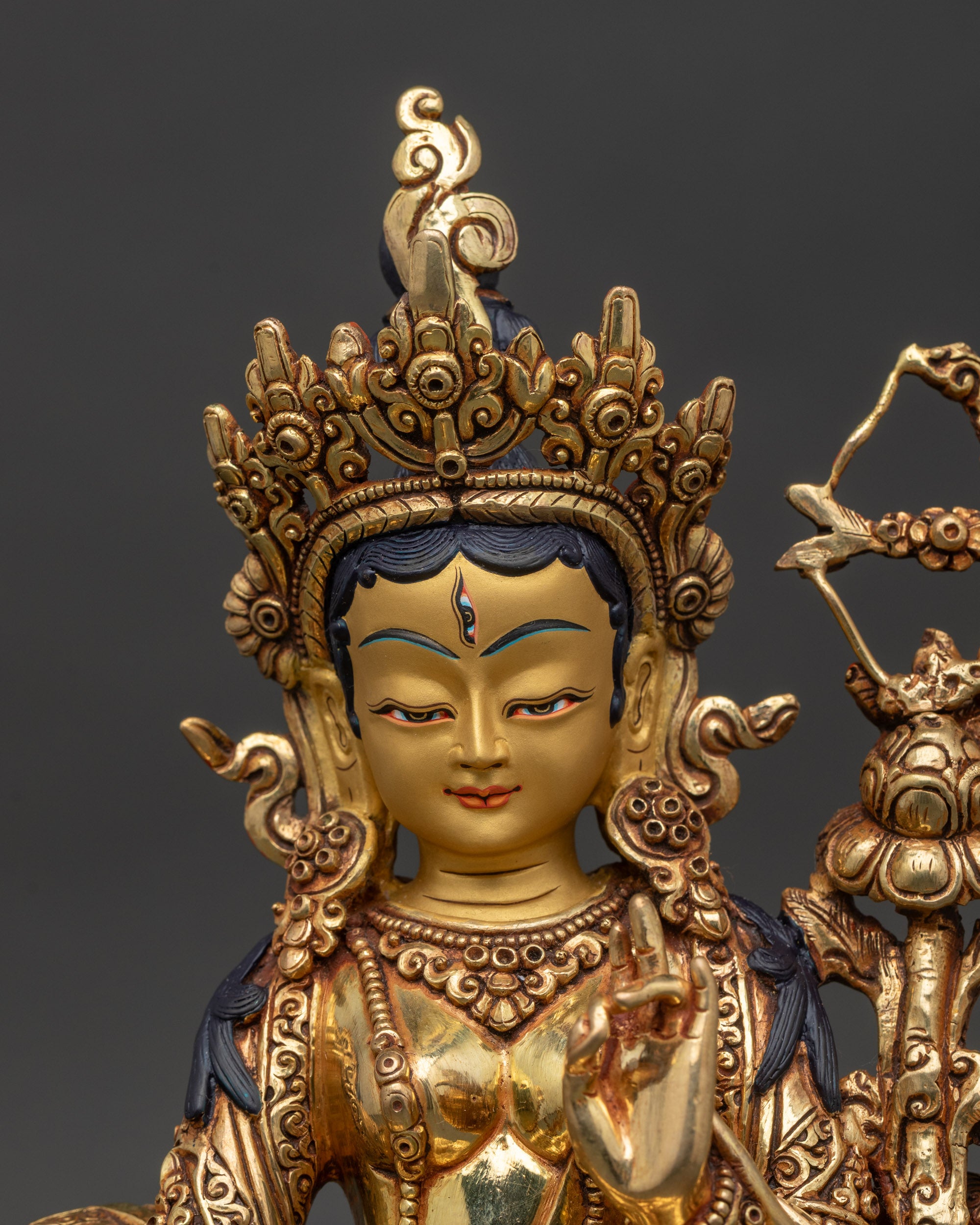 red-tara-statue-close-up-gold-painted-face-third-eye-five-jeweled-crown-patan-nepal