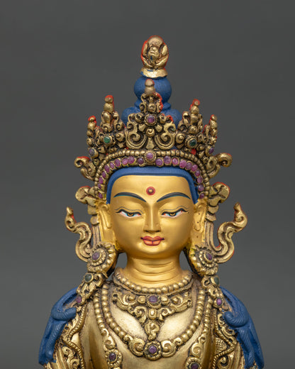 Regular close-up of Amitayus statue showing intricate copper and gold details