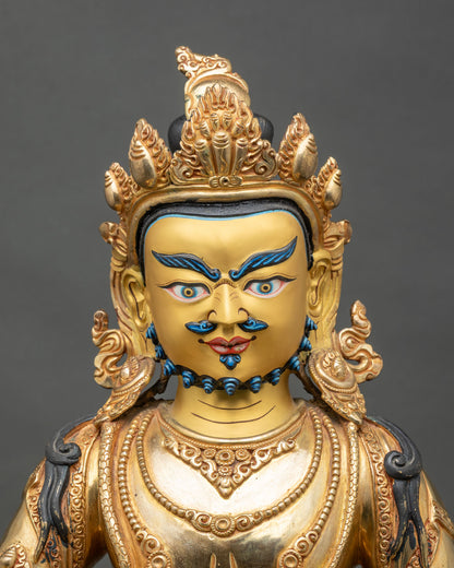 Regular close-up of Dzambhala Statue showing copper and gold details, Himalayan artistry
