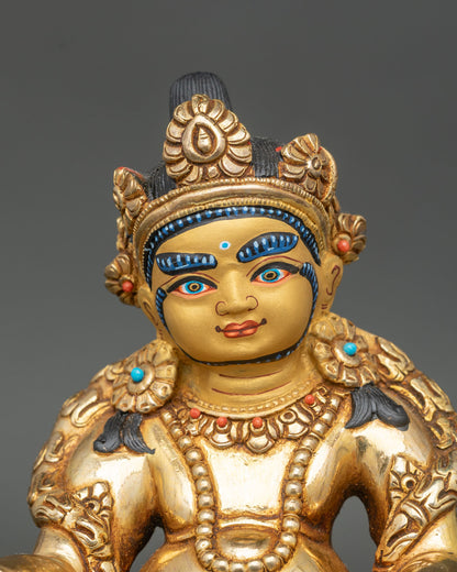 Regular close up dzambhala statue showing copper and fire-gilded gold details