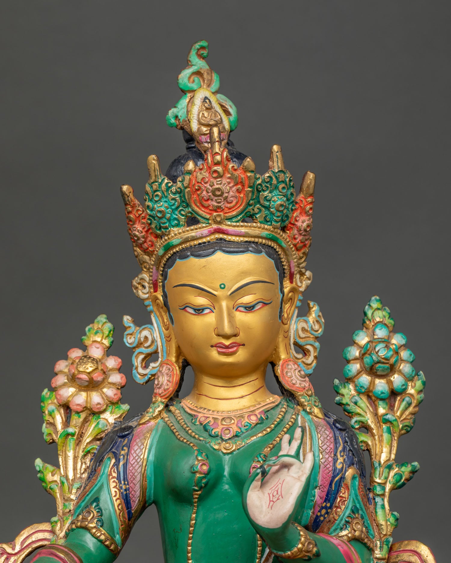 Regular close up Green Tara Buddhist statue highlighting hand painted details and sacred altar finish
