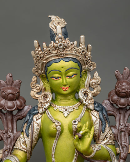 Regular close-up of Green Tara statue showing copper and acrylic details