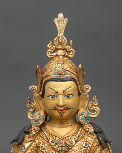 Regular close-up of Guru Rinpoche trio statue showing intricate gold and gemstone details