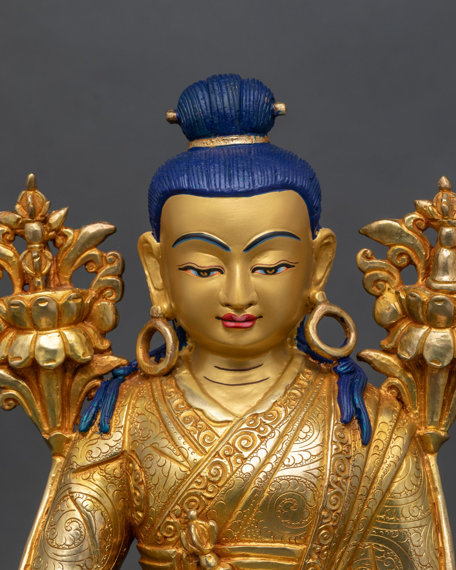 Regular close-up of Jigme Lingpa statue showing intricate copper and gold details