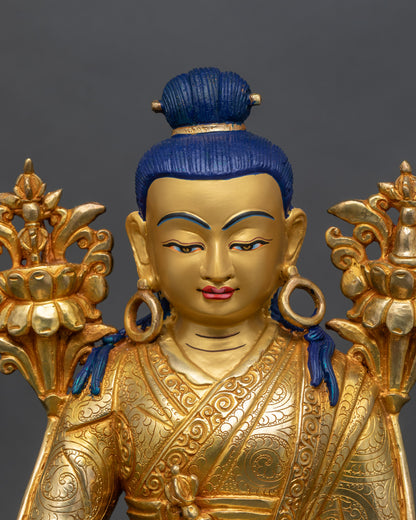 Regular close-up of Jigme Lingpa statue showing intricate copper and gold details
