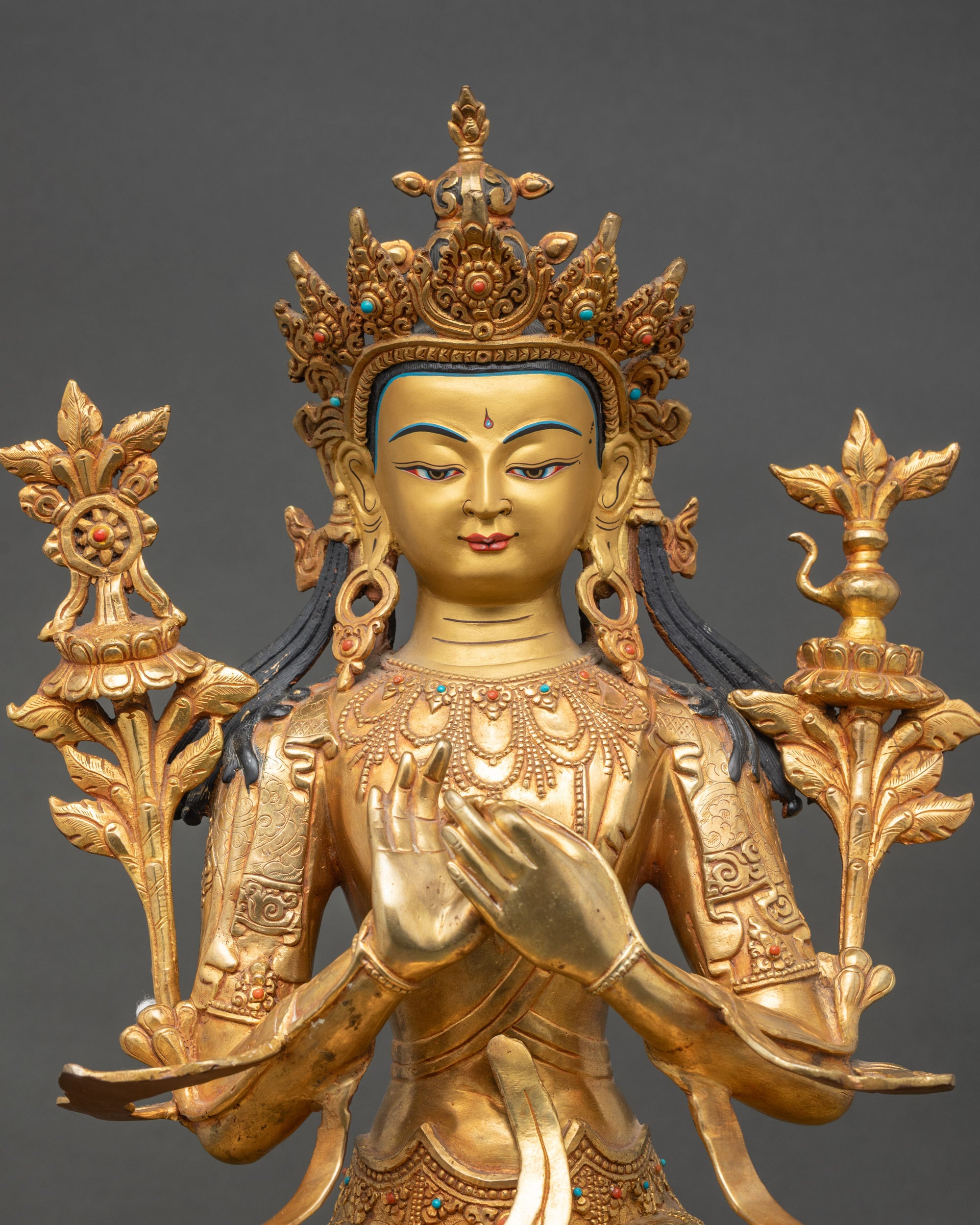 close up view of maitreya buddha statue, gold gilded copper, ornate details