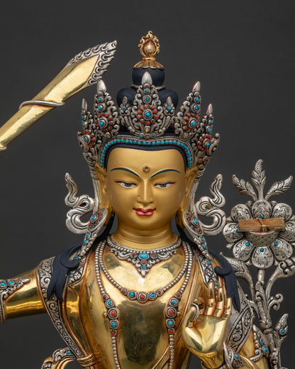 Close up of Manjushri Statue with gold gilding silver plating and intricate craftsmanship